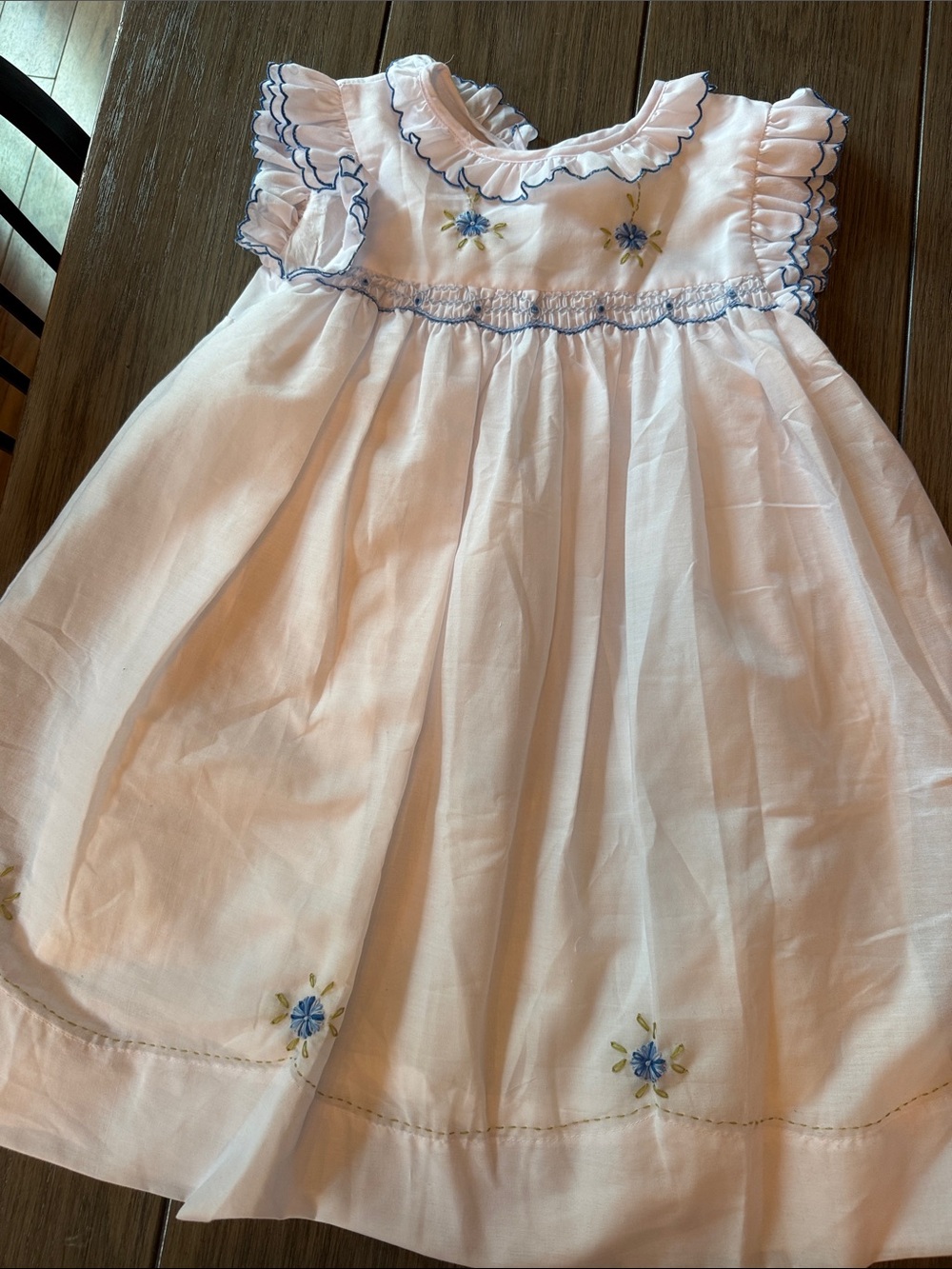 White Smocked Girls Dress with Blue Floral Accents